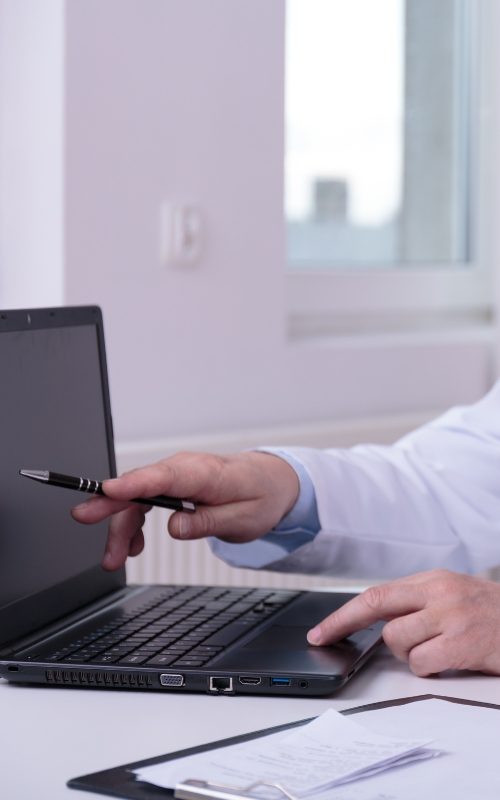 doctor pointing to laptop screen