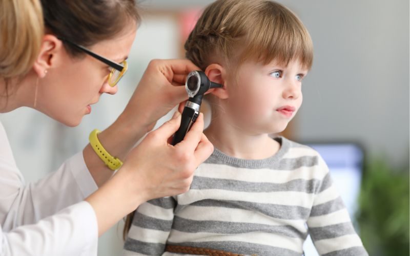 ent consultant checking child's ear