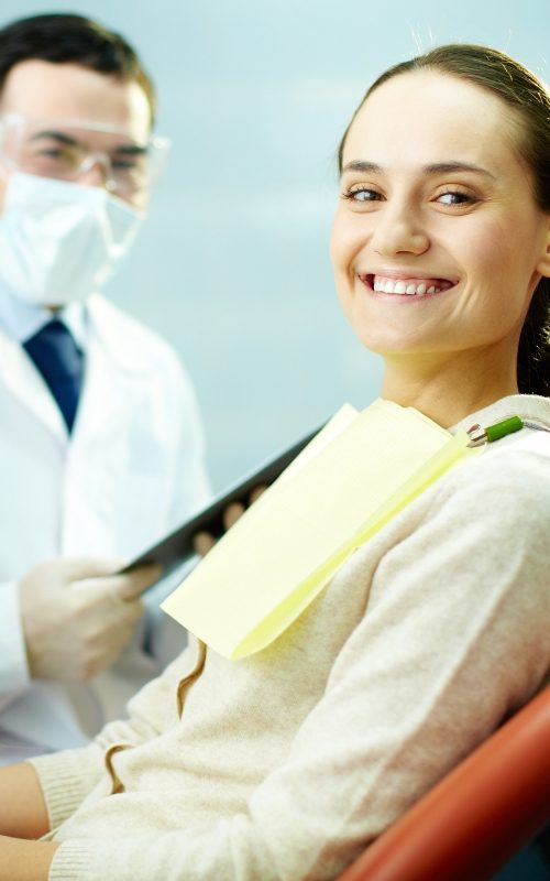 female patient smiling at the dentist